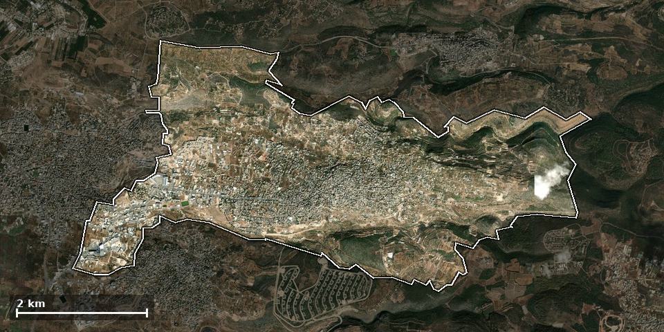 תצלום אוויר של ירכא, ותחום השיפוט המוניציפלי מסומן עליו